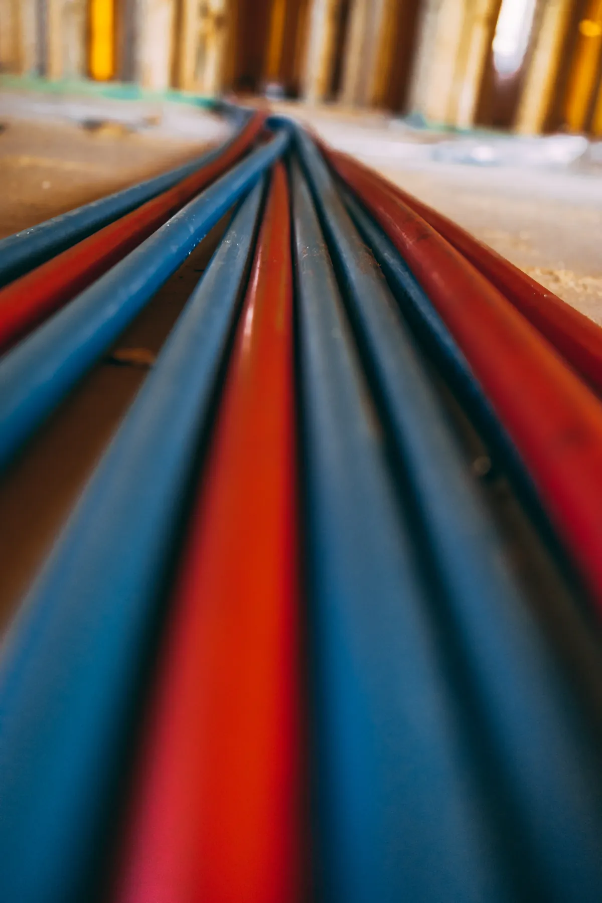 Coiled red and blue PEX tubing ready for a repipe – Navien Tankless Water Heater Installation for Laguna Niguel, CA homes