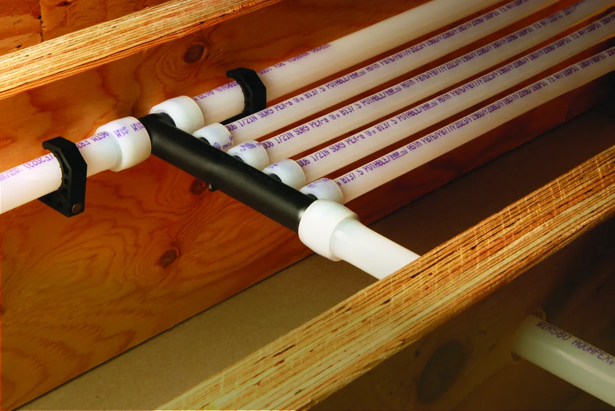 PEX multiport tee mounted across floor joists – How to Increase Water Pressure in Your Laguna Niguel House (and When the Pipes Are the Real Problem) for Laguna Niguel, CA homes