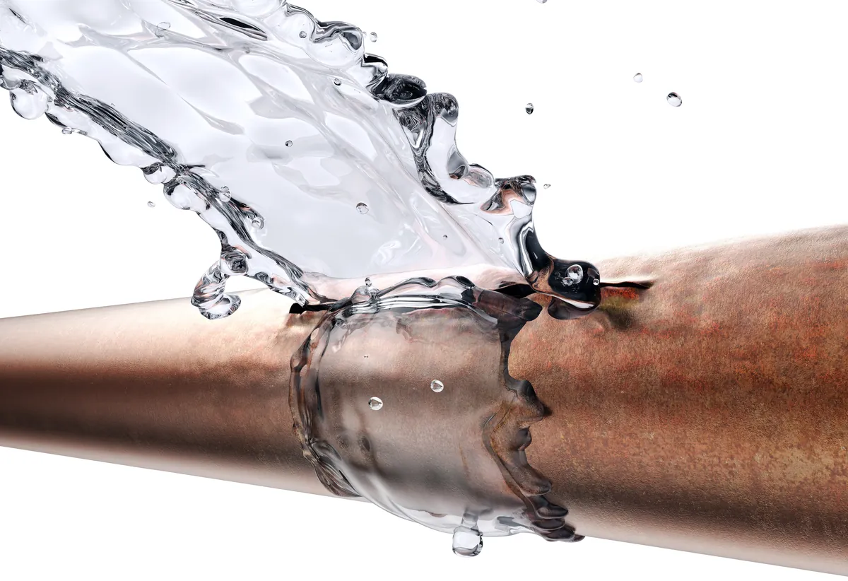 Water splashing from a corroded copper pipe, from our Laguna Niguel guide: Leak Detection